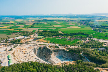 Fototapeta na wymiar Aerial view of a large open pit mine in a rural landscape