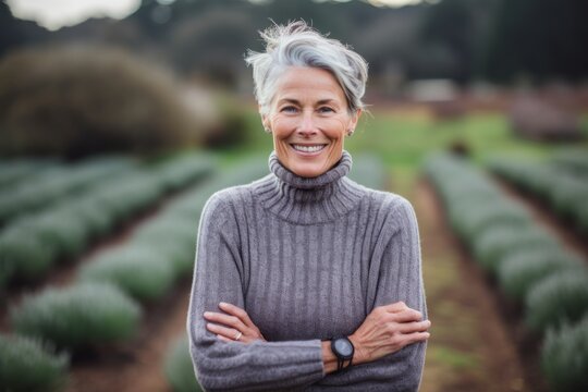 Environmental portrait photography of a glad mature girl wearing a classic turtleneck sweater against a serene tea garden background. With generative AI technology