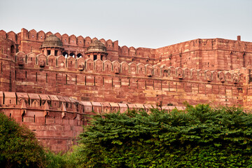 Walls of Agra red fort in India, view from main entrance Amar Singh Gate to beautiful ancient building, red fort in Agra built of red sandstone, Lal Qila historical ancient building