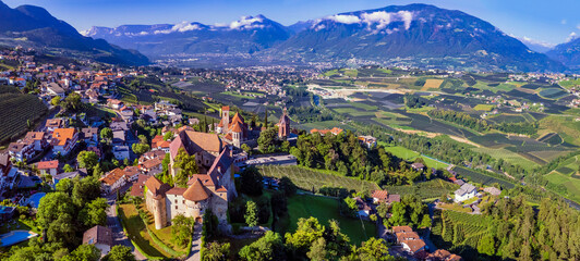 Tourism in northen Italy.  Traditional picturesque mountain village Schenna (Scena) near Merano town in Trentino - Alto Adige region. aerial drone high angle view