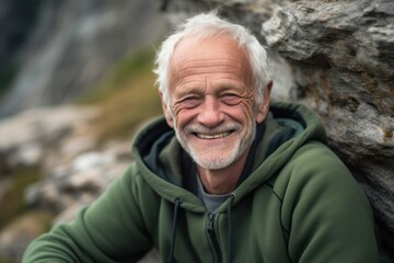 Close-up portrait photography of a grinning old man wearing a comfortable hoodie against a serene rock garden background. With generative AI technology