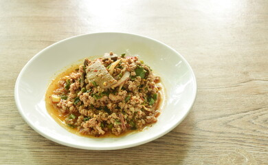 Thai spicy and sour boiled chop pork with liver salad on plate