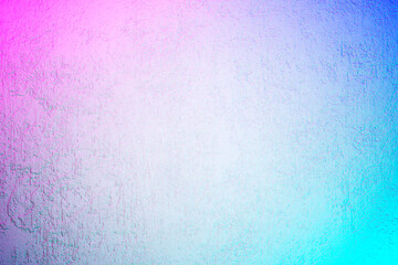 White textured concrete wall with laser neon lights. Abstract iridescent grunge background with holographic colors.