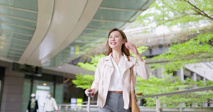 Asian business woman happily trip