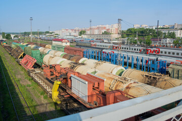 Train cars on rails at the station and freight cars, top view
