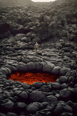 Obraz premium Bold Adventurer Conquering Red-Hot Lava Rocks - generative ai