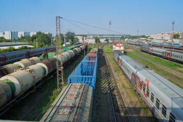Train cars on rails at the station and freight cars, top view