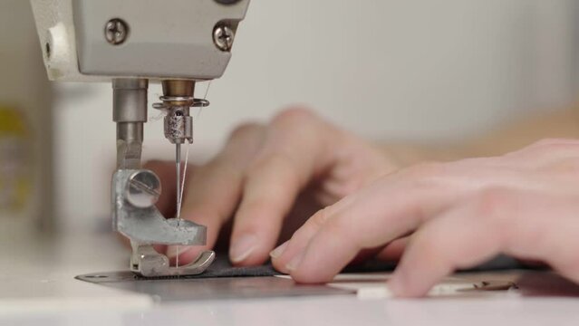 Working on industrial garment machine, flat machine