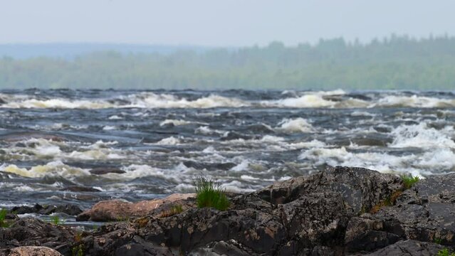 Boulders in a big river with rapids