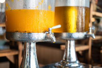 Fresh lemonade mixed with passion fruits juice, contained in the glass cooling tank. Refreshing...