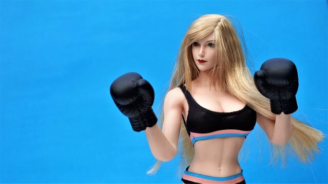 Beautiful girl model in Boxing Gloves &ndash; Women's Boxing, Women's fights, boxing girl model. Fitness model, athletic figure, women's sportswear, sportswear style
