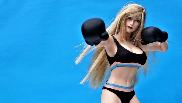 Beautiful girl model in Boxing Gloves &ndash; Women's Boxing, Women's fights, boxing girl model. Fitness model, athletic figure, women's sportswear, sportswear style
