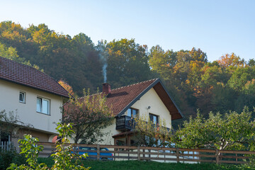 Fototapeta na wymiar Landscape with a house in the autumn.