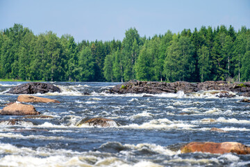 Fototapeta na wymiar Sunlit Wilderness Scenic River Flowing Through Northern Sweden