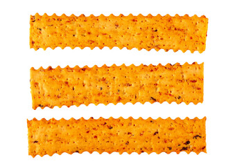 Crackers with dried tomatoes and black olives isolated on white, top view