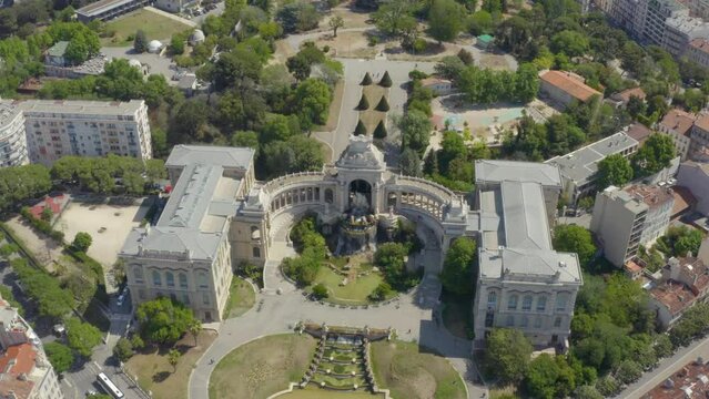 Aerial shot of the Palais Longchamp with its statues and fountains, in Marseille, France