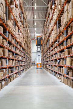 Order picking stacker trucks in warehouse 
