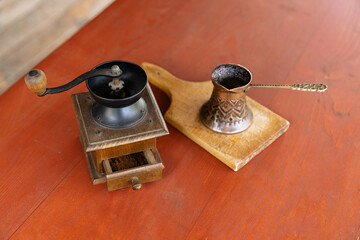 Obraz na płótnie Canvas Vintage coffee pot and manual coffee grinder. Retro style of making natural espresso