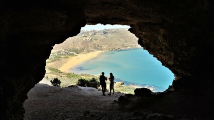 hiker in the cave - obrazy, fototapety, plakaty