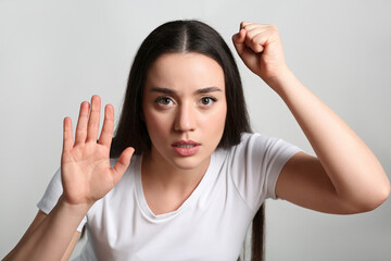 Young woman stuck to transparent screen. Internet addiction