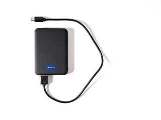 Power bank for charging mobile devices on a white background. Smartphone charger with power supply....