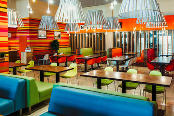 Modern restaurant interior with bright red and green design