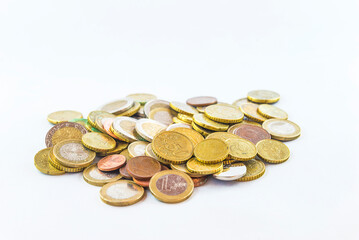 Heap of various of euros metallic coins on white background