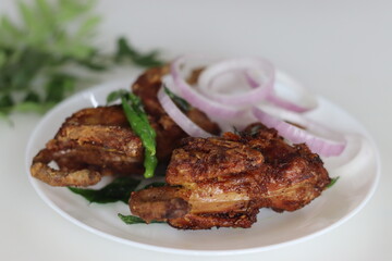 Kada fry or Quail fry. Deep fried quail meat marinated with red chili powder, pepper, ginger garlic paste, salt and lime juice