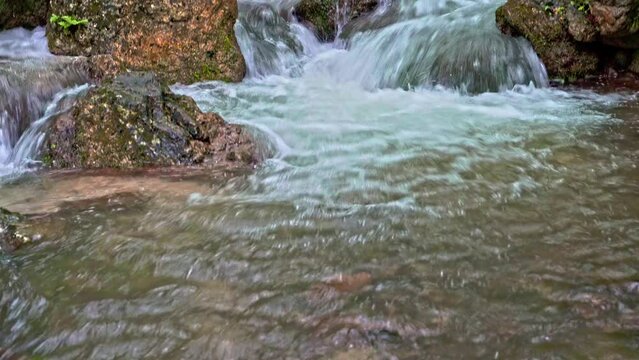 Sagittario river flows fast between rocks and woods near the Cavuto Springs, Anversa, Abruzzo, Italy, Europe