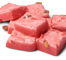 cubes of jelly pudding, close-up of delicious sweet dish made with fresh cream, condensed milk and strawberry jelly and spread prune isolated on white background, selective focus