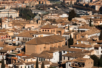 Panoramic landscape of Granada, Spain with blue sky.