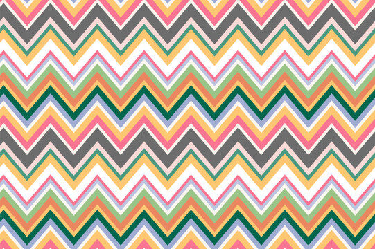 Chevron repeat pattern made of multicolored zigzags. Boho surface design for printing on fabrics.