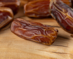 Dried fruit. Munefi dates. Premium. Macro. Brown date. Delicious dried fruits.