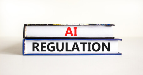 AI regulation symbol. Concept words AI artificial intelligence regulation on beautiful books. Beautiful white background. Business AI artificial intelligence regulation concept. Copy space