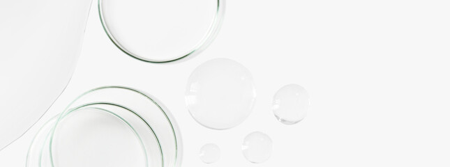 Petri dishes, flasks, test tubes. On a light background. Drops and smears of transparent gel. Laboratory. Banner. empty space for advertising