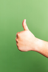 thumb up on green background