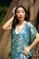 Fototapeta premium young beautiful asian woman with long hair in tropical