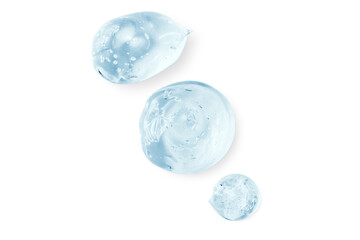 Composition of smears and drops or drops of a transparent blue gel, serum. On an empty transparent background.