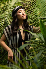 Asian woman posing on tropical resort