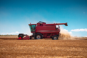 Combine harvester machine working in a wheat field
