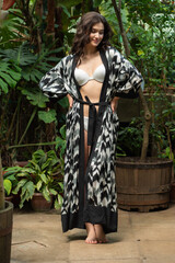 Beautiful young sensual woman wearing light summer dress on tropical resort