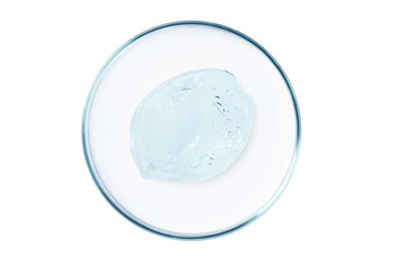 Petri dish with a drop and a smear of a transparent gel or serum on an empty background.