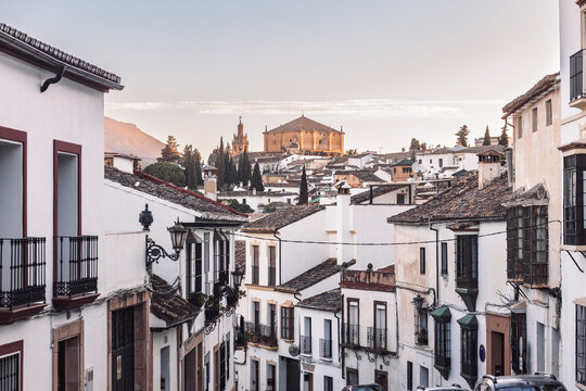 Views of the medieval village of Ronda with white Andalusian houses and the gothic style church of Santuario de Mar a Auxiliadora. Malaga, Spain
