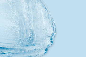 Flowing transparent gel on a blue background. Banner with empty space for advertising.