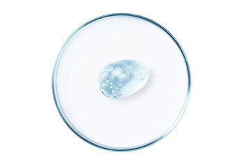 Petri dish with a drop and a smear of a transparent gel or serum on an empty background.