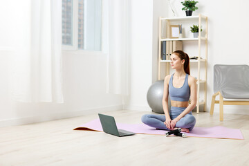 woman home yoga health laptop lotus mat lifestyle copy training space video