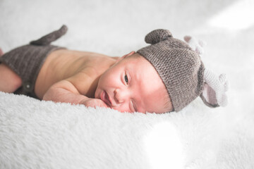 Cute baby sleeping 5 days old on light blanket. Banner design with space for text