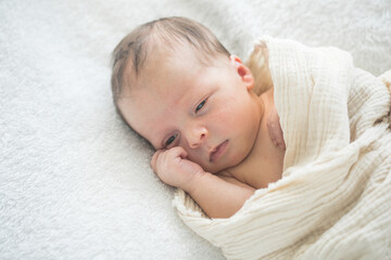 Cute baby sleeping 5 days old on light blanket. Banner design with space for text