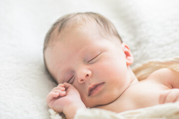 Cute baby sleeping 5 days old on light blanket. Banner design with space for text