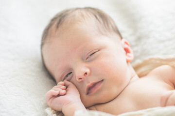 Cute baby sleeping 5 days old on light blanket. Banner design with space for text